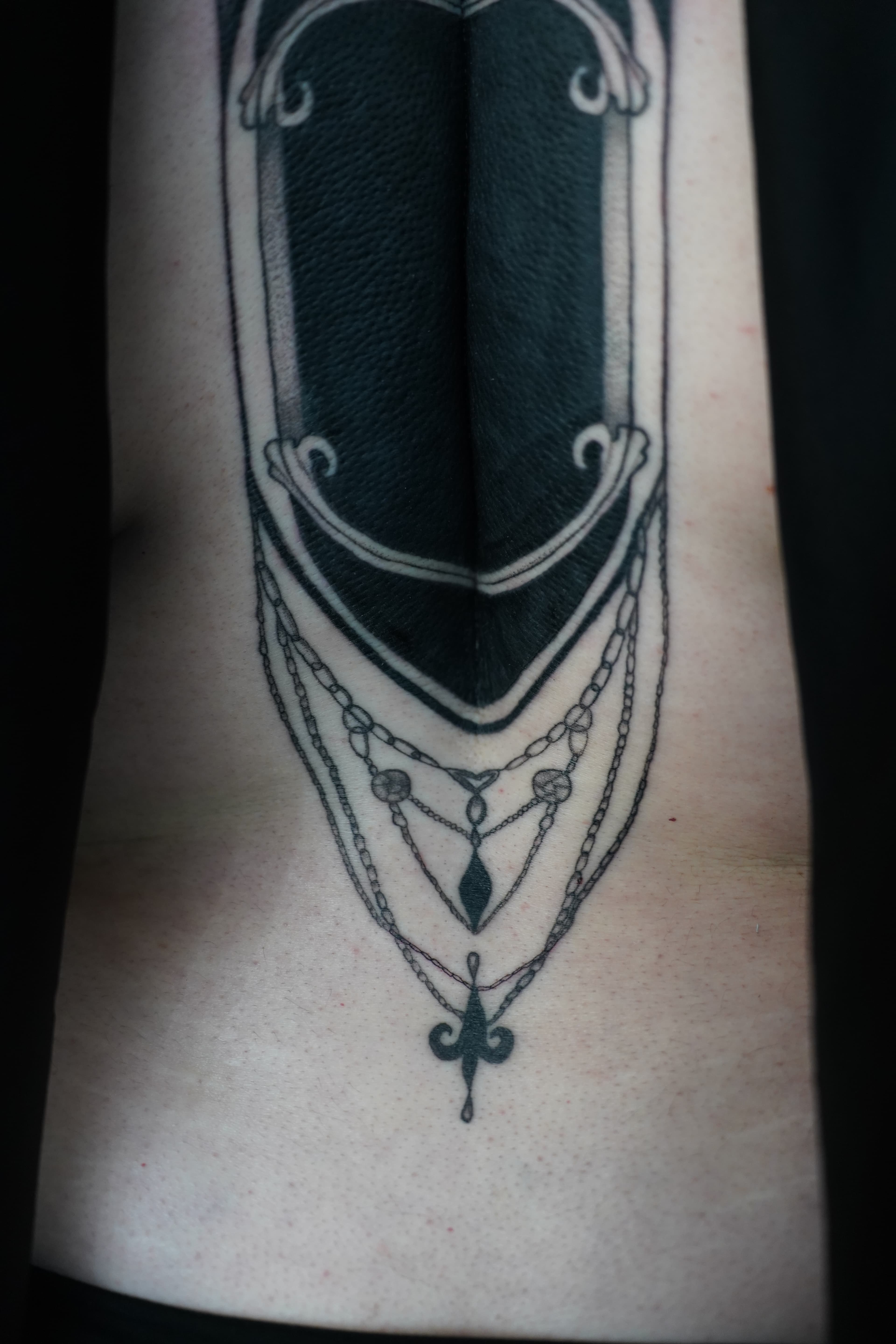 Close detail of a gothic cathedral back tattoo by Nika Osseili.