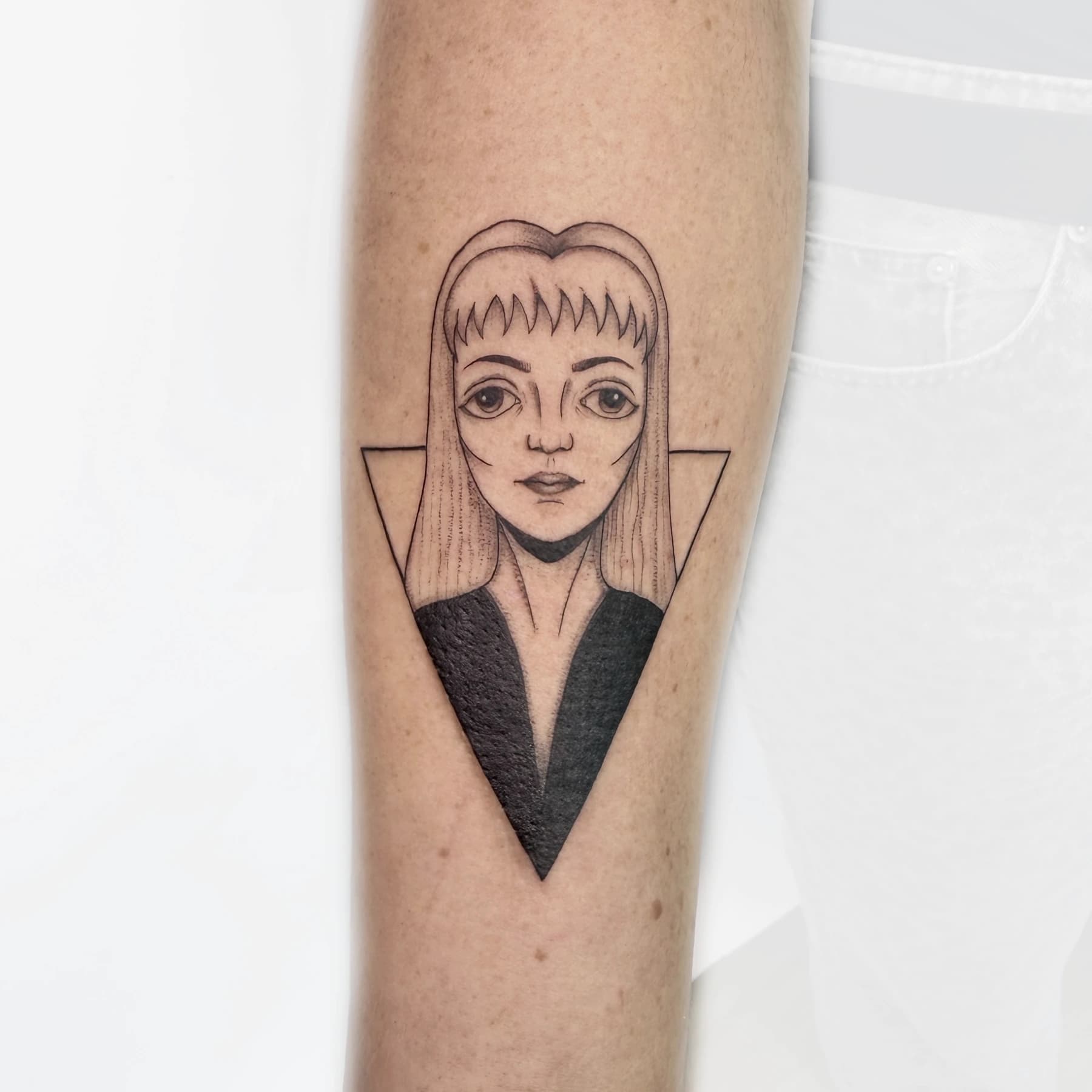 Fine line Laura Palmer portrait tattoo on the forearm by Nika Osseili.