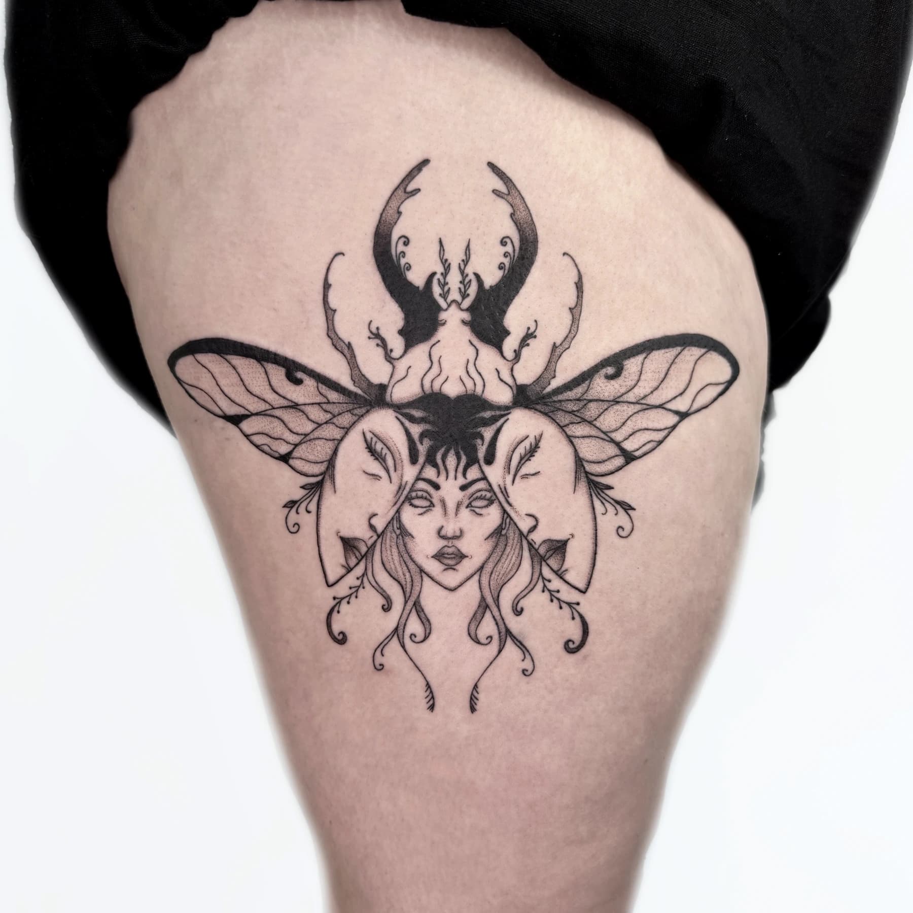 Winged beetle surreal portrait tattoo by Nika Osseili.